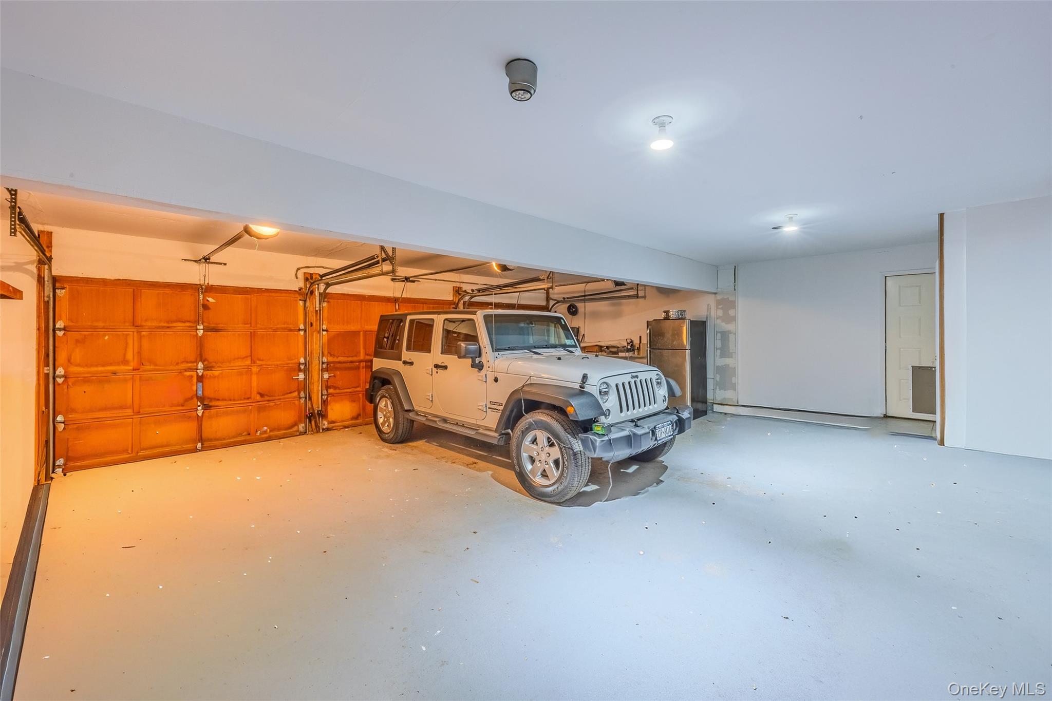 18 Golf Club Road St. James, NY 11780 - Photo 31 of 47 a car parked in garage