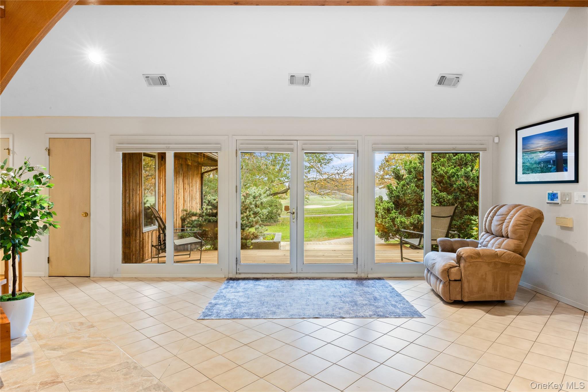 18 Golf Club Road St. James, NY 11780 - Photo 5 of 47 a entryway of a livingroom with furniture and garden