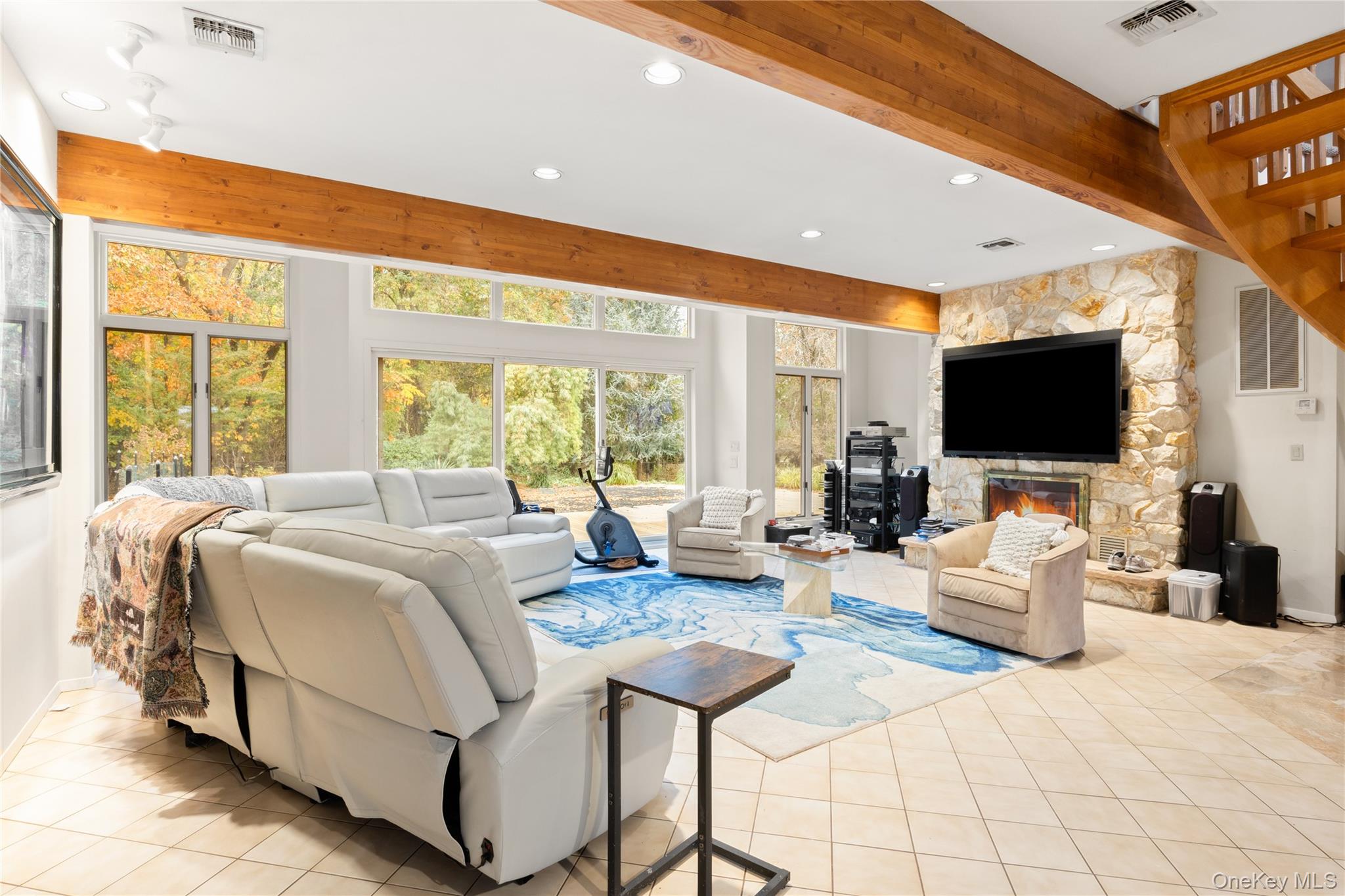 18 Golf Club Road St. James, NY 11780 - Photo 9 of 47 a spacious bedroom with a large bed and a flat screen tv