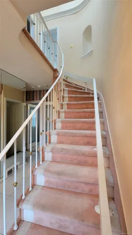 an empty room with a empty space and windows