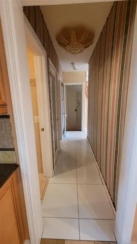 a kitchen with stainless steel appliances granite countertop a refrigerator and a stove