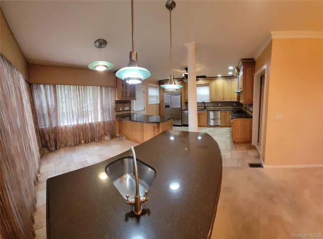 a view of kitchen and dining area with wooden floor