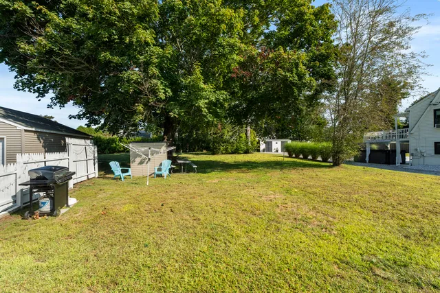a swimming pool with some trees in the background