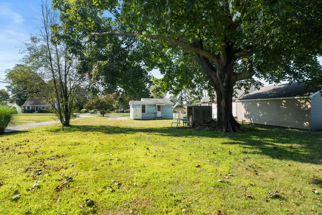 a house with trees in front of it