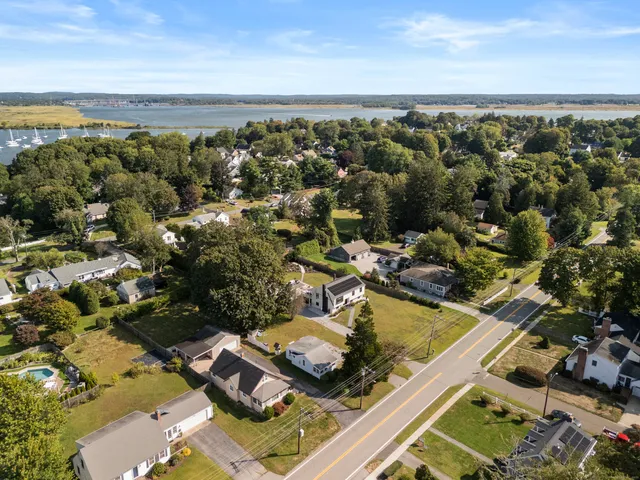 an aerial view of a house with a ocean view
