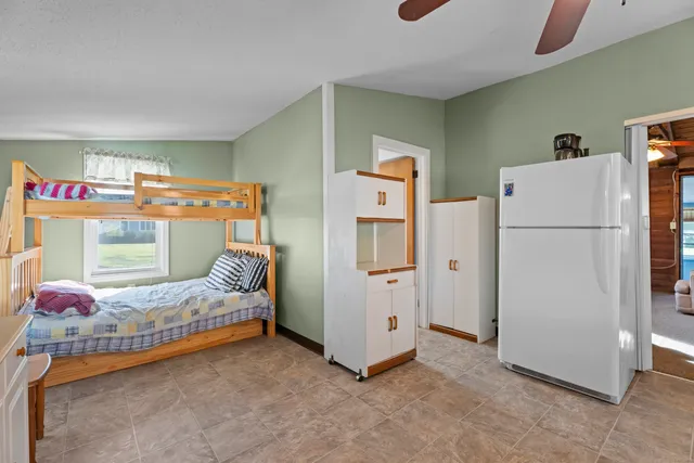 a bedroom with furniture and a bed