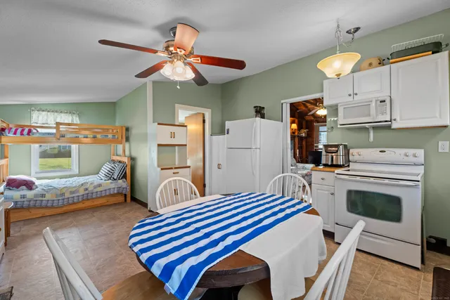 a bedroom with furniture and a fireplace
