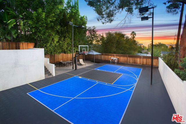 a view of a tennis court with a large pool