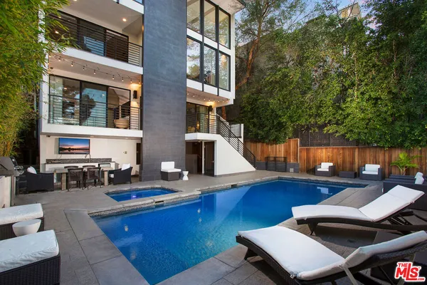 a front view of house with outdoor seating