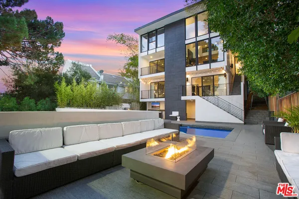 a view of a building and with couches in a patio
