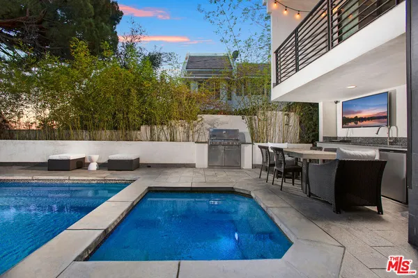 a view of kitchen and hall with dining area