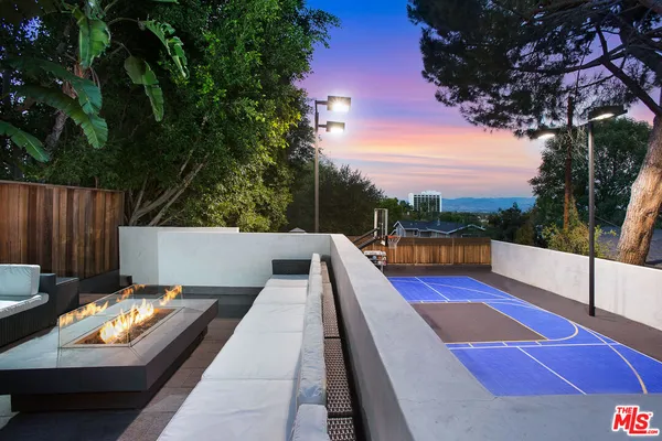 a view of swimming pool with a lounge chair