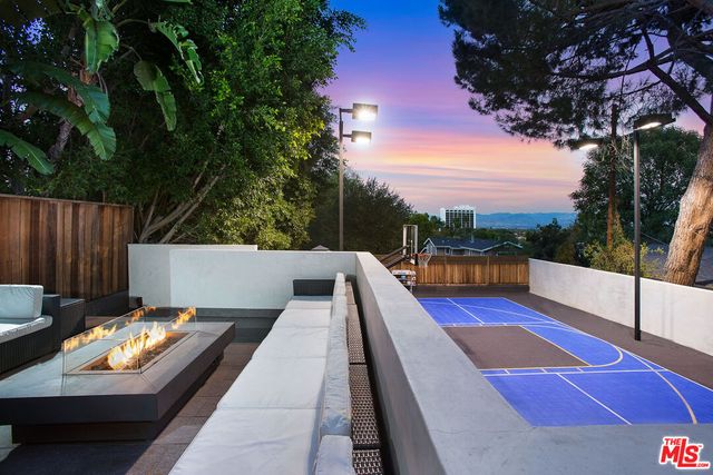 a view of swimming pool with a lounge chair