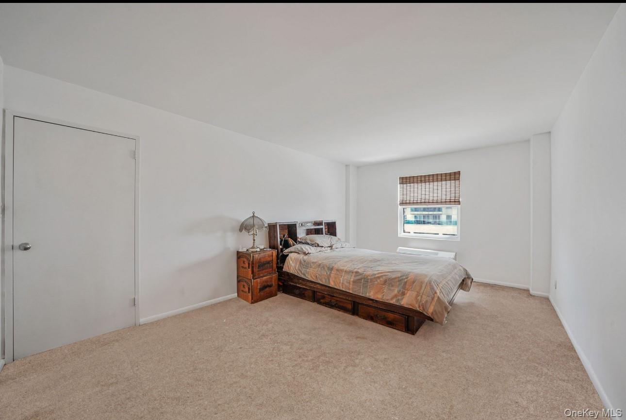 360 Shore Road, Unit 4B Long Beach, NY 11561 - Photo 25 of 28 a bed room with a bed and a window