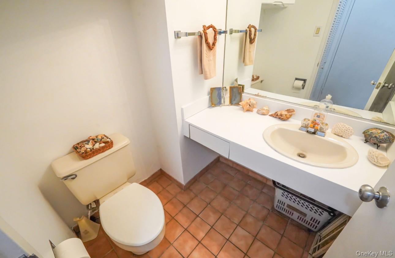 360 Shore Road, Unit 4B Long Beach, NY 11561 - Photo 27 of 28 a bathroom with a sink toilet and shower