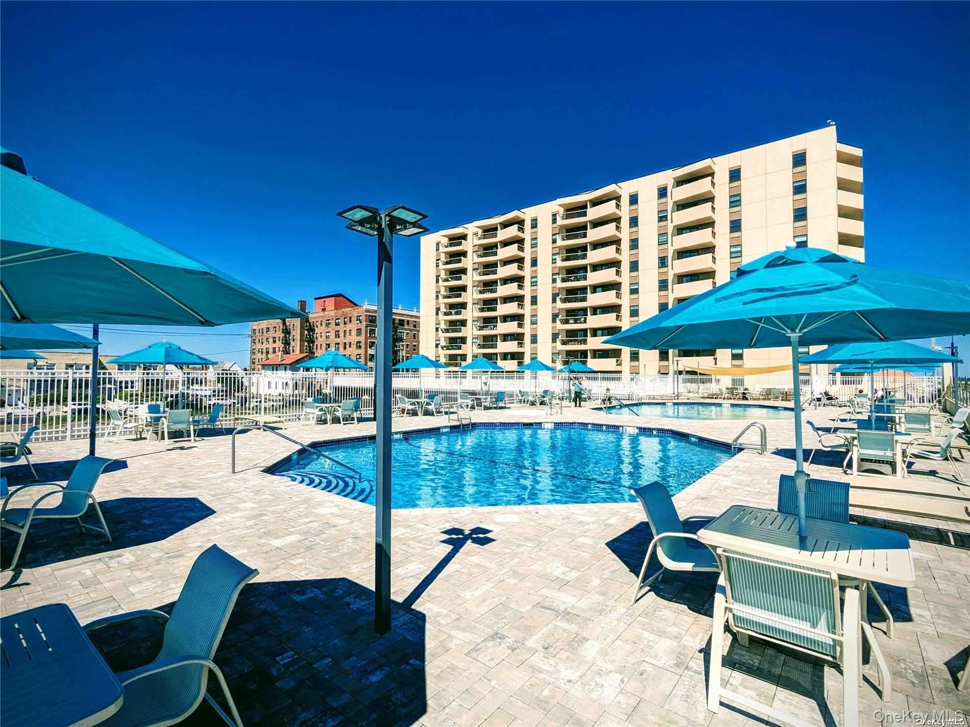 360 Shore Road, Unit 4B Long Beach, NY 11561 - Photo 5 of 28 a outdoor space with patio the tables and chairs