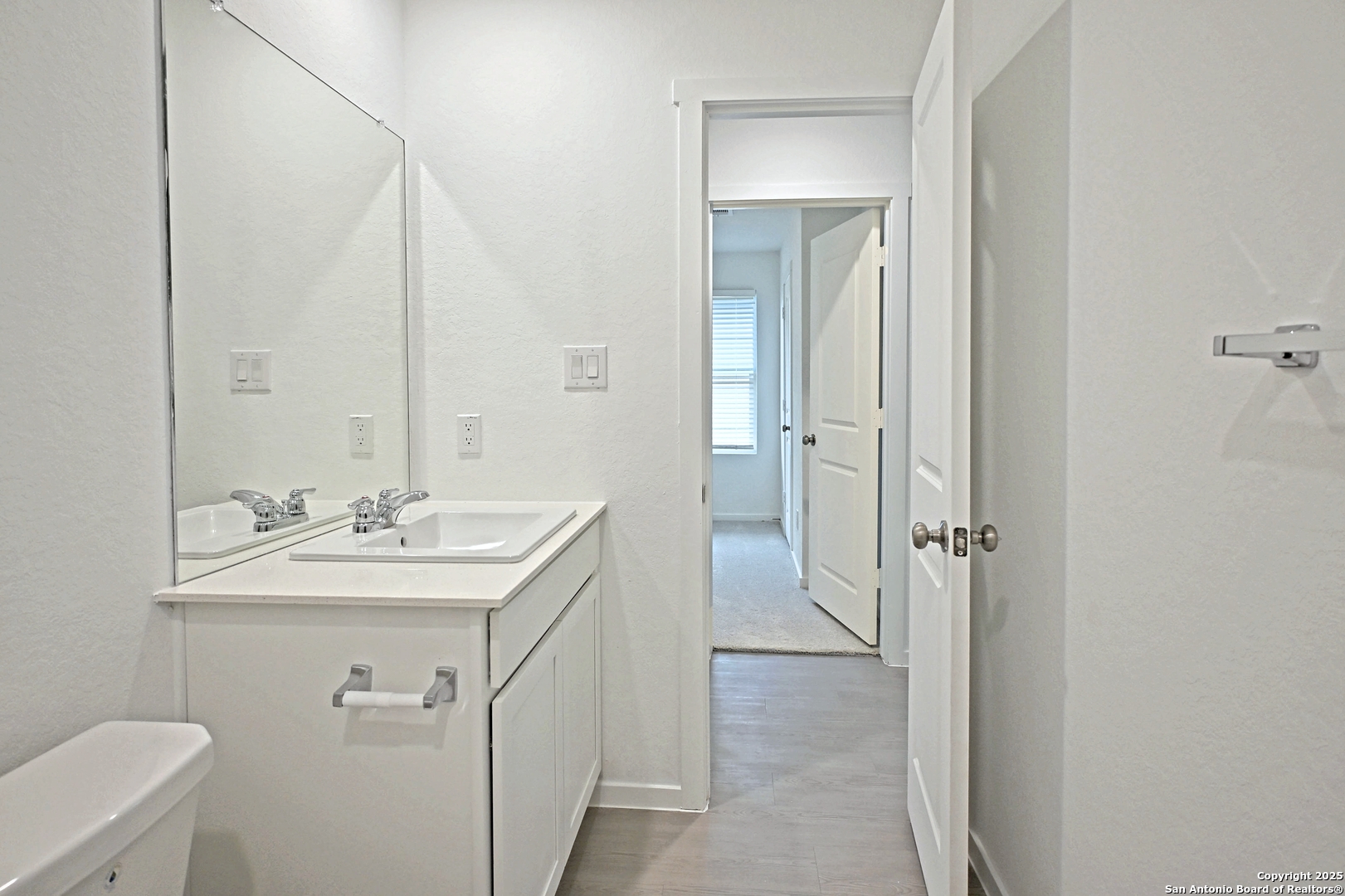 3805 Swift Fox Road New Braunfels, TX 78132 - Photo 11 of 27 a bathroom with a sink a toilet and shower