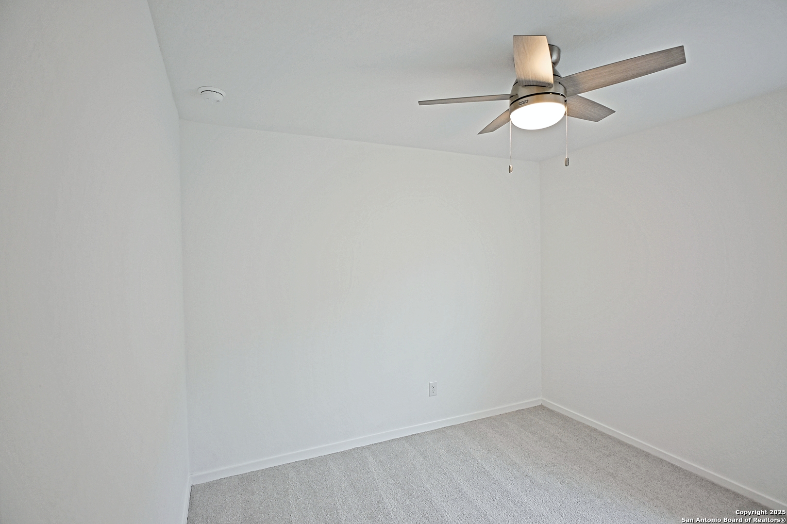 3805 Swift Fox Road New Braunfels, TX 78132 - Photo 12 of 27 a view of a small space with wooden floor and a window