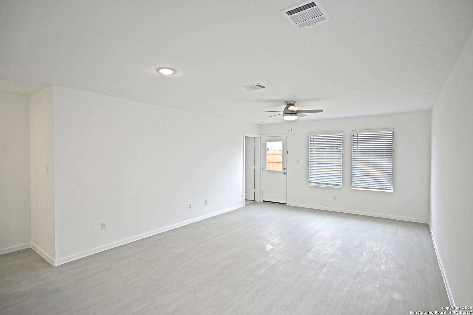 3805 Swift Fox Road New Braunfels, TX 78132 - Photo 15 of 27 an empty room with windows and ceiling fan