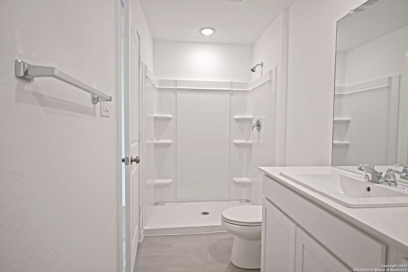 3805 Swift Fox Road New Braunfels, TX 78132 - Photo 21 of 27 a bathroom with a sink a toilet and shower