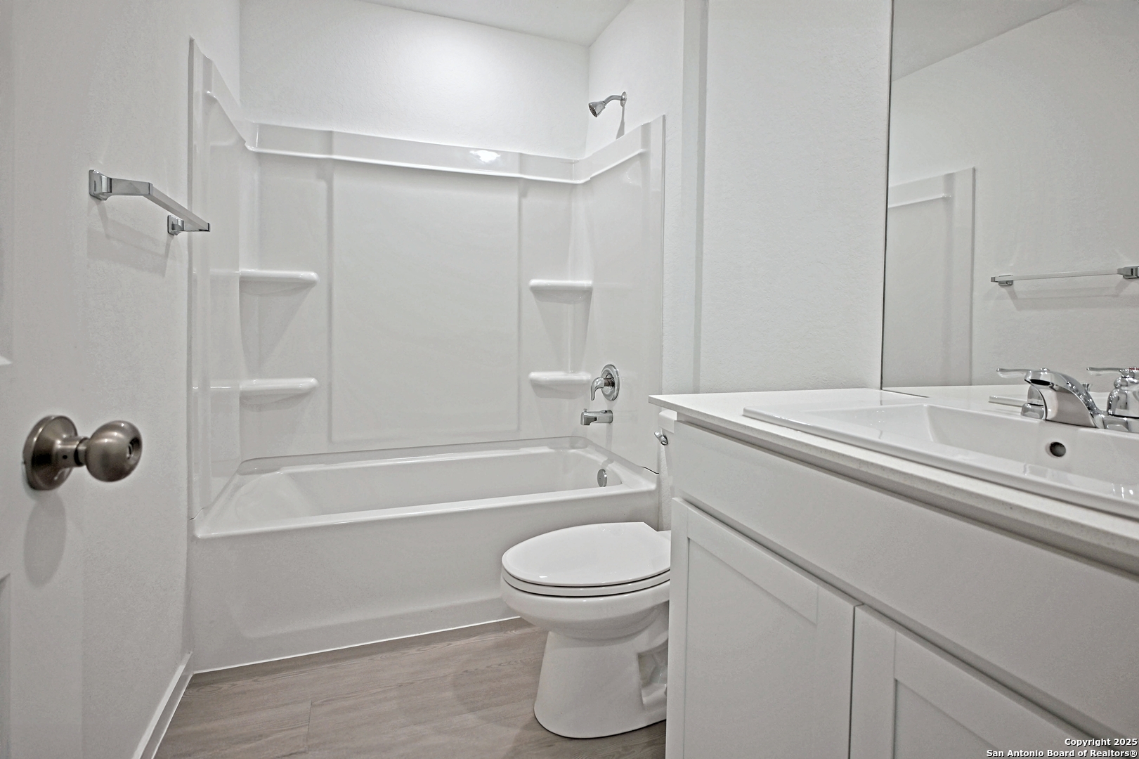 3805 Swift Fox Road New Braunfels, TX 78132 - Photo 10 of 27 a bathroom with a sink a toilet and a bathtub