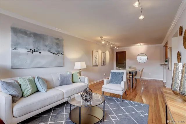 a living room with furniture and a table