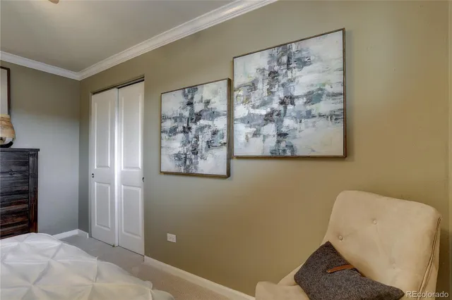 a view of a hallway with paintings on the wall