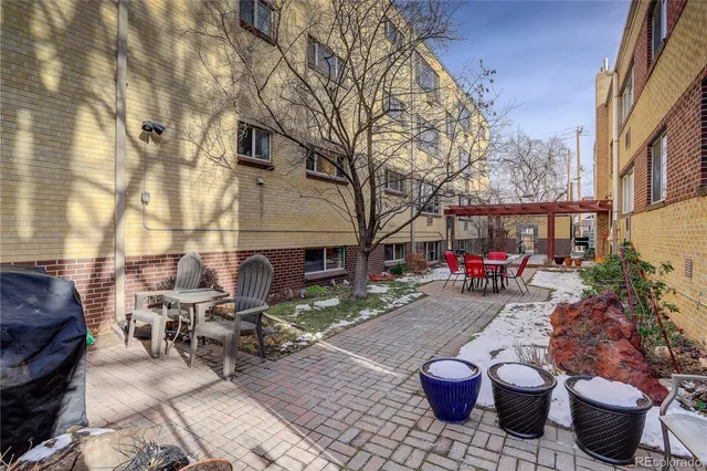 a view of a patio with couches and potted plants