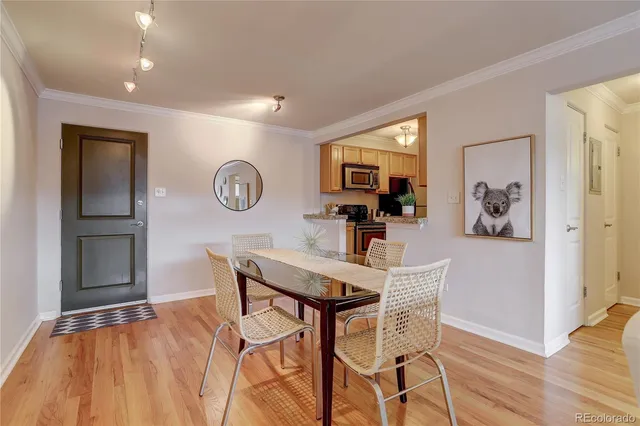 a view of a dining room with furniture and wooden floor