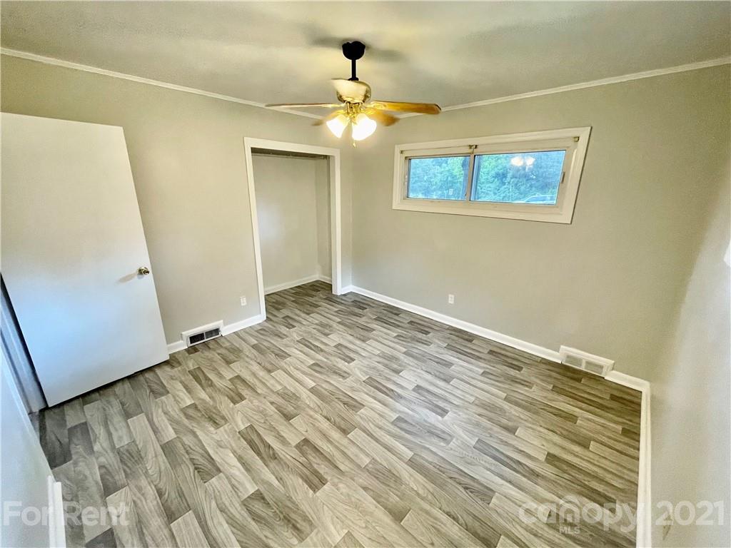 7125 Pence Road, Unit 2 Charlotte, NC 28215 - Photo 13 of 16 a view of empty room with wooden floor