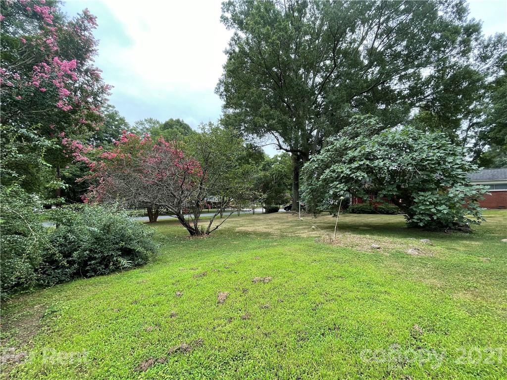 7125 Pence Road, Unit 2 Charlotte, NC 28215 - Photo 3 of 16 a view of backyard with green space