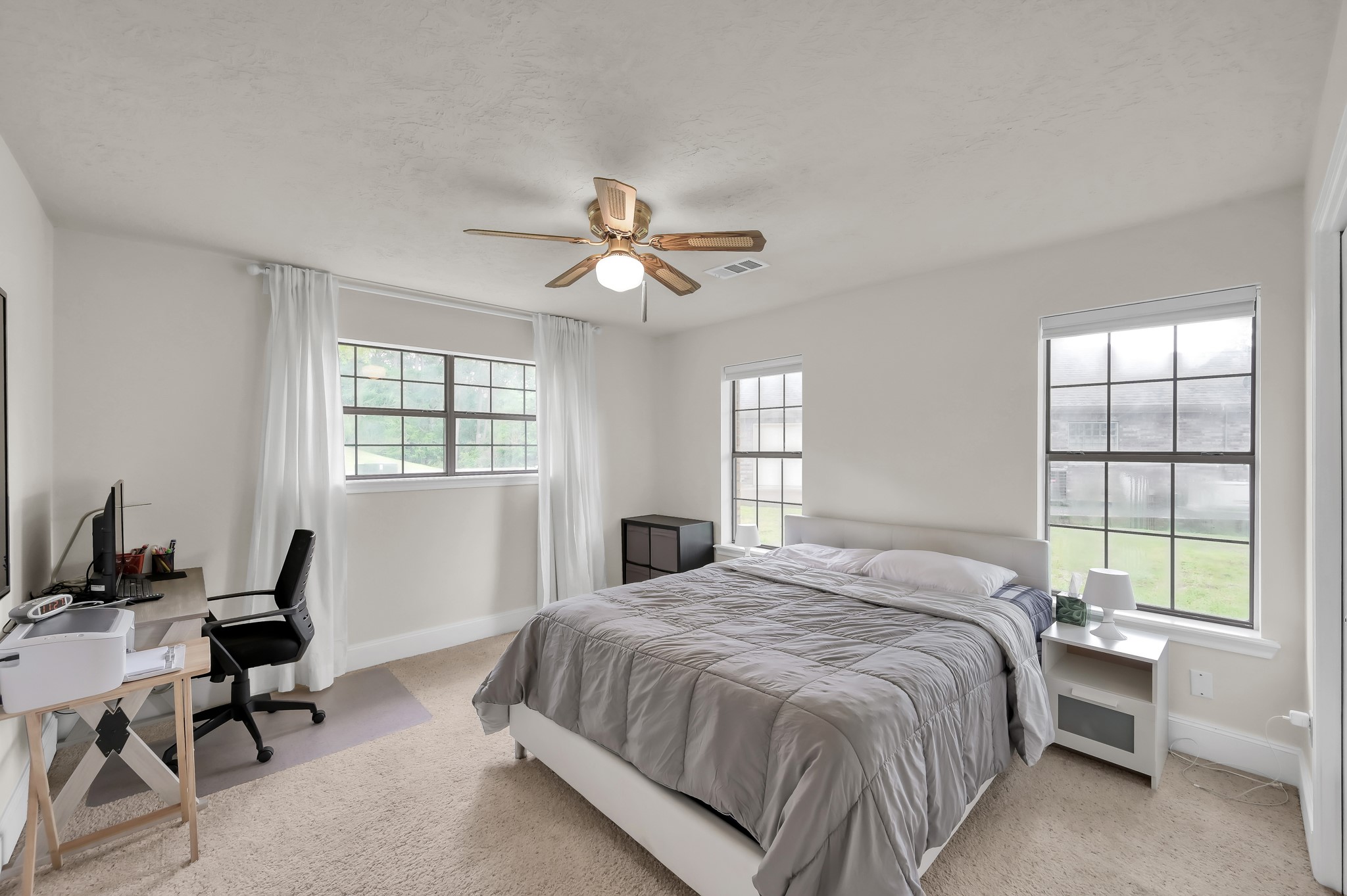 117 Brookside Drive Trinity, TX 75862 - Photo 12 of 46 Primary styled bedroom, downstairs has a large footprint with plenty of natural light coming through several windows, plus room for a small office area.