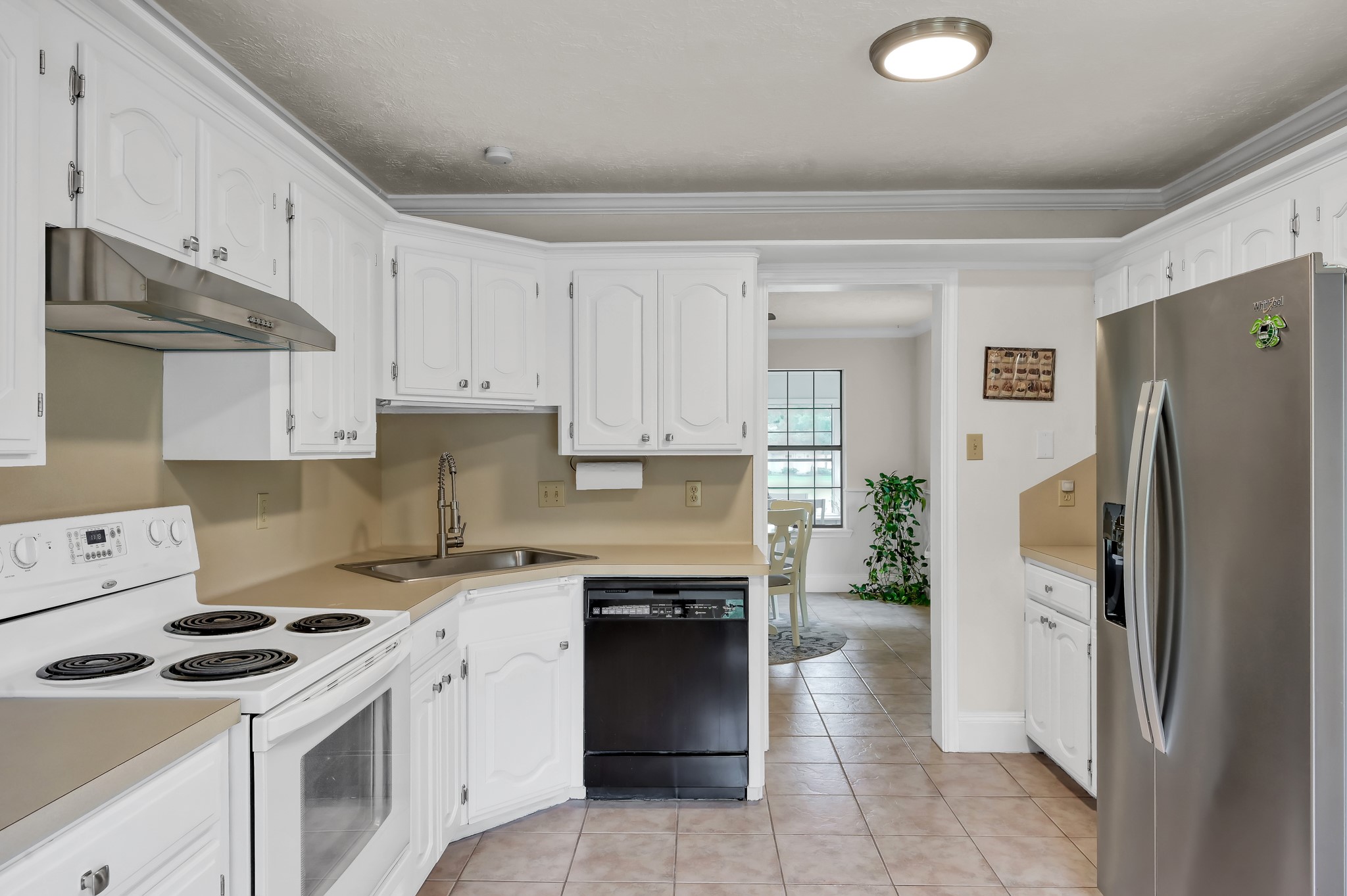 117 Brookside Drive Trinity, TX 75862 - Photo 15 of 46 a kitchen with a stove a refrigerator and a sink