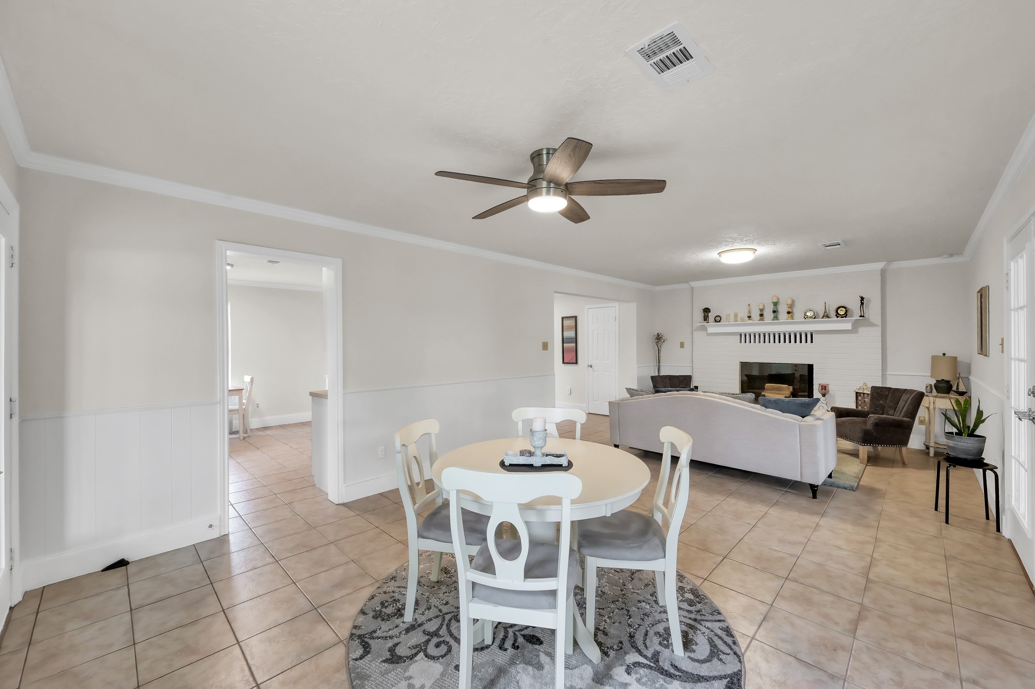 117 Brookside Drive Trinity, TX 75862 - Photo 19 of 46 An alternative view of the dining area that highlights the living area beyond, with the kitchen pass-through to the left.