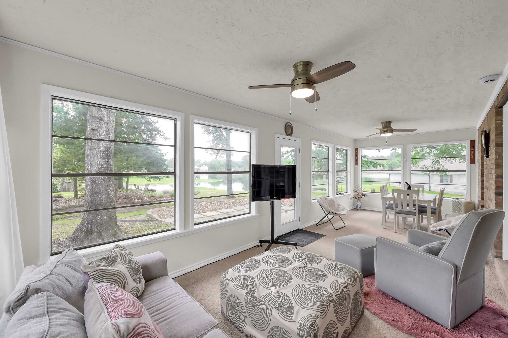 117 Brookside Drive Trinity, TX 75862 - Photo 21 of 46 Full view of the sunroom offers expansive views, making it a perfect space for family get-togethers.