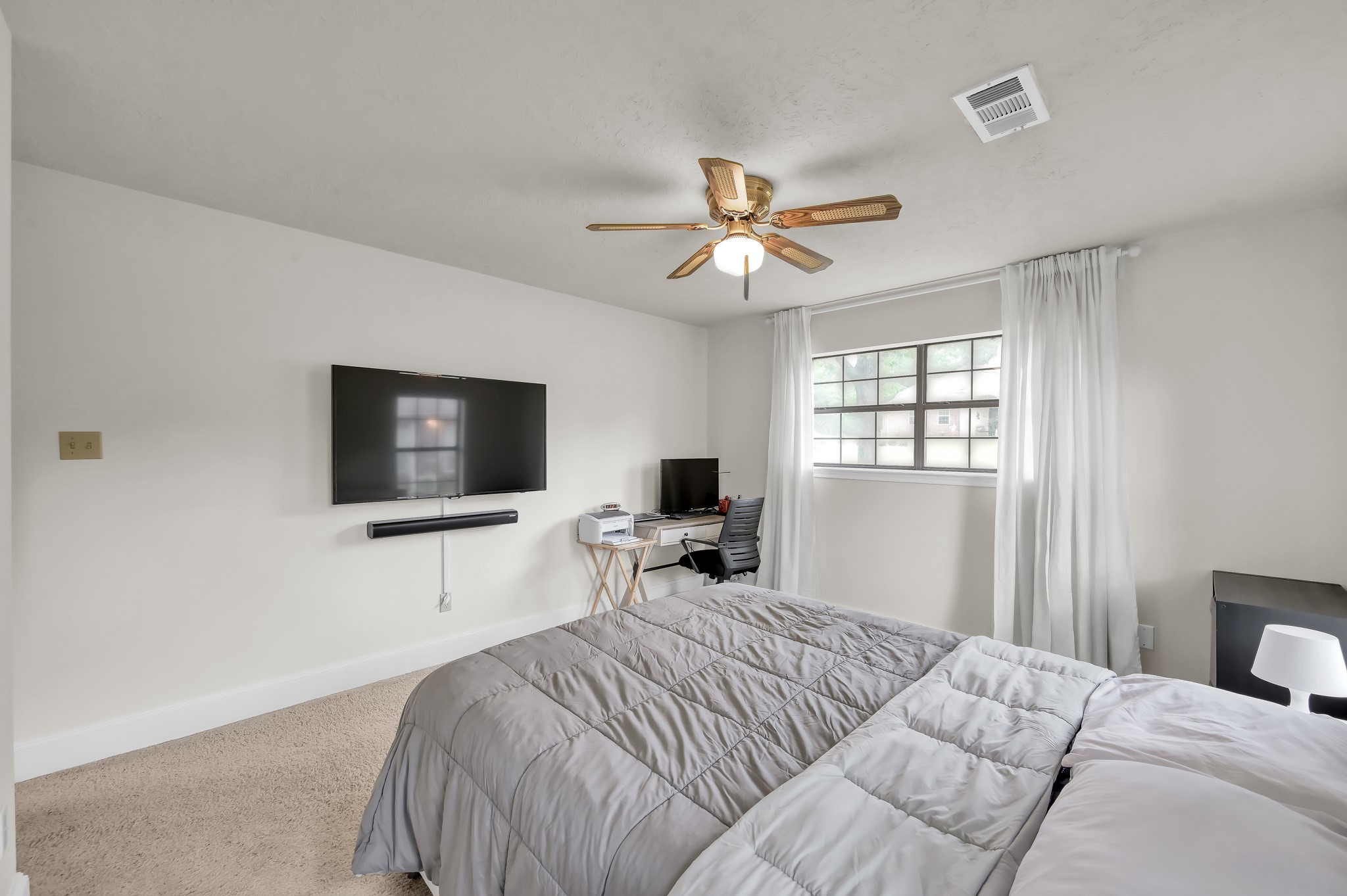 117 Brookside Drive Trinity, TX 75862 - Photo 24 of 46 a bedroom with a bed and a flat screen tv