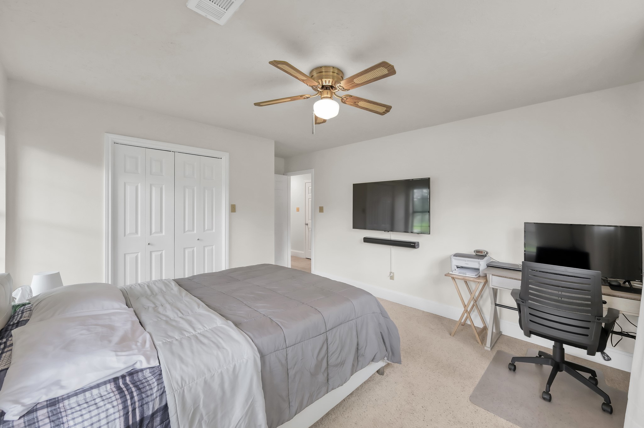117 Brookside Drive Trinity, TX 75862 - Photo 25 of 46 a bedroom with a bed and a flat screen tv