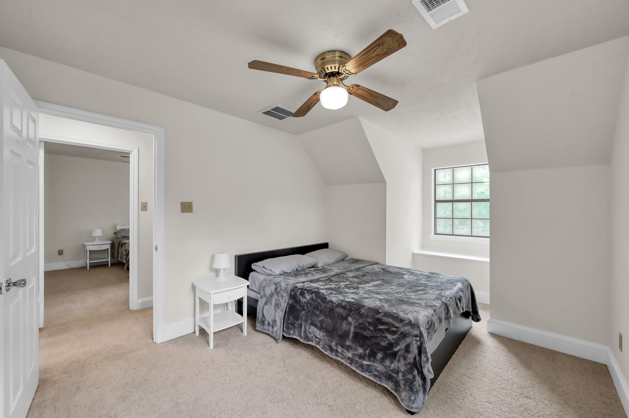 117 Brookside Drive Trinity, TX 75862 - Photo 32 of 46 a bedroom with a bed and a chandelier