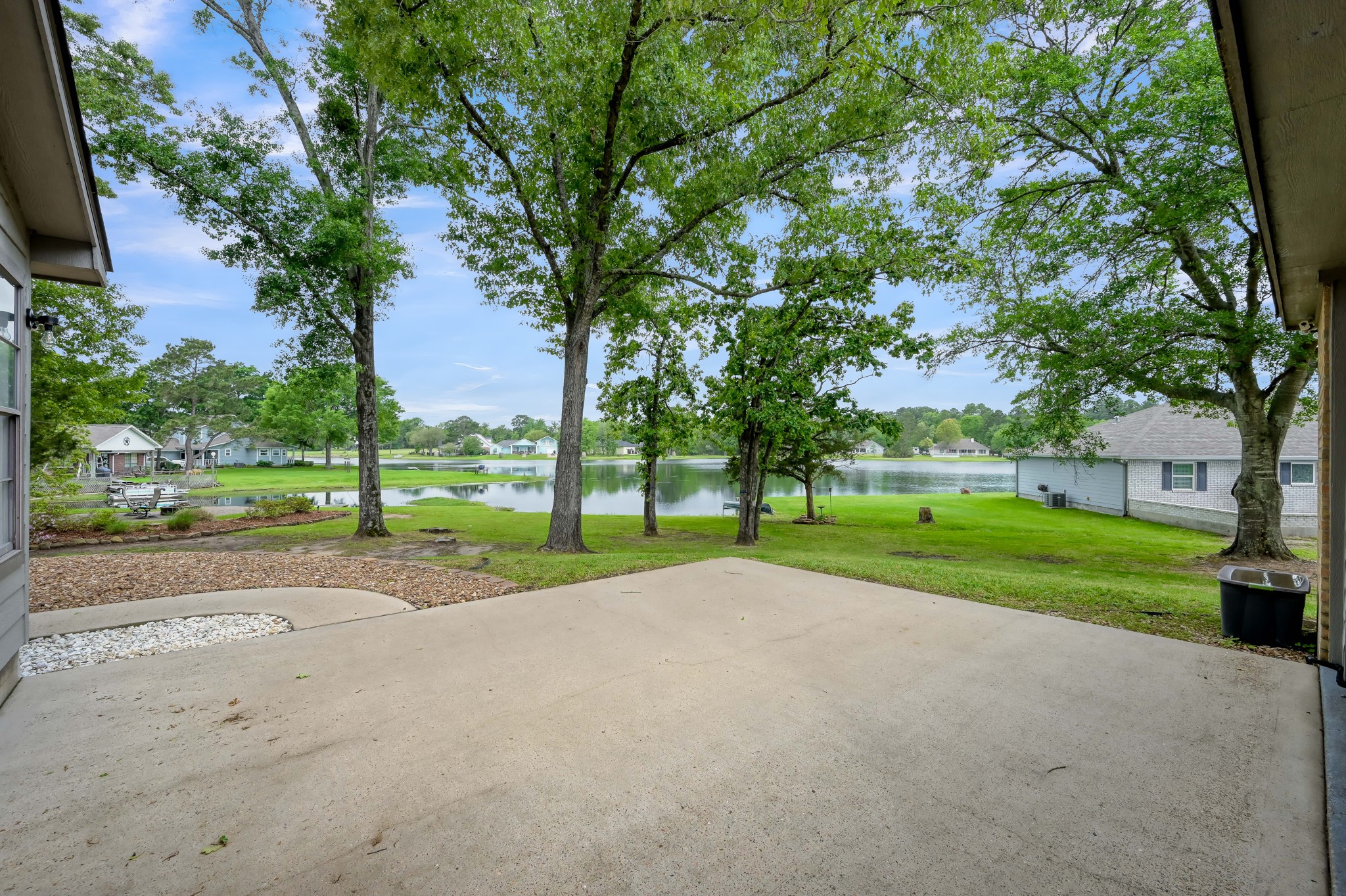 117 Brookside Drive Trinity, TX 75862 - Photo 4 of 46 Large concrete patio just beyond rear of the garage. Check out the lakeview.