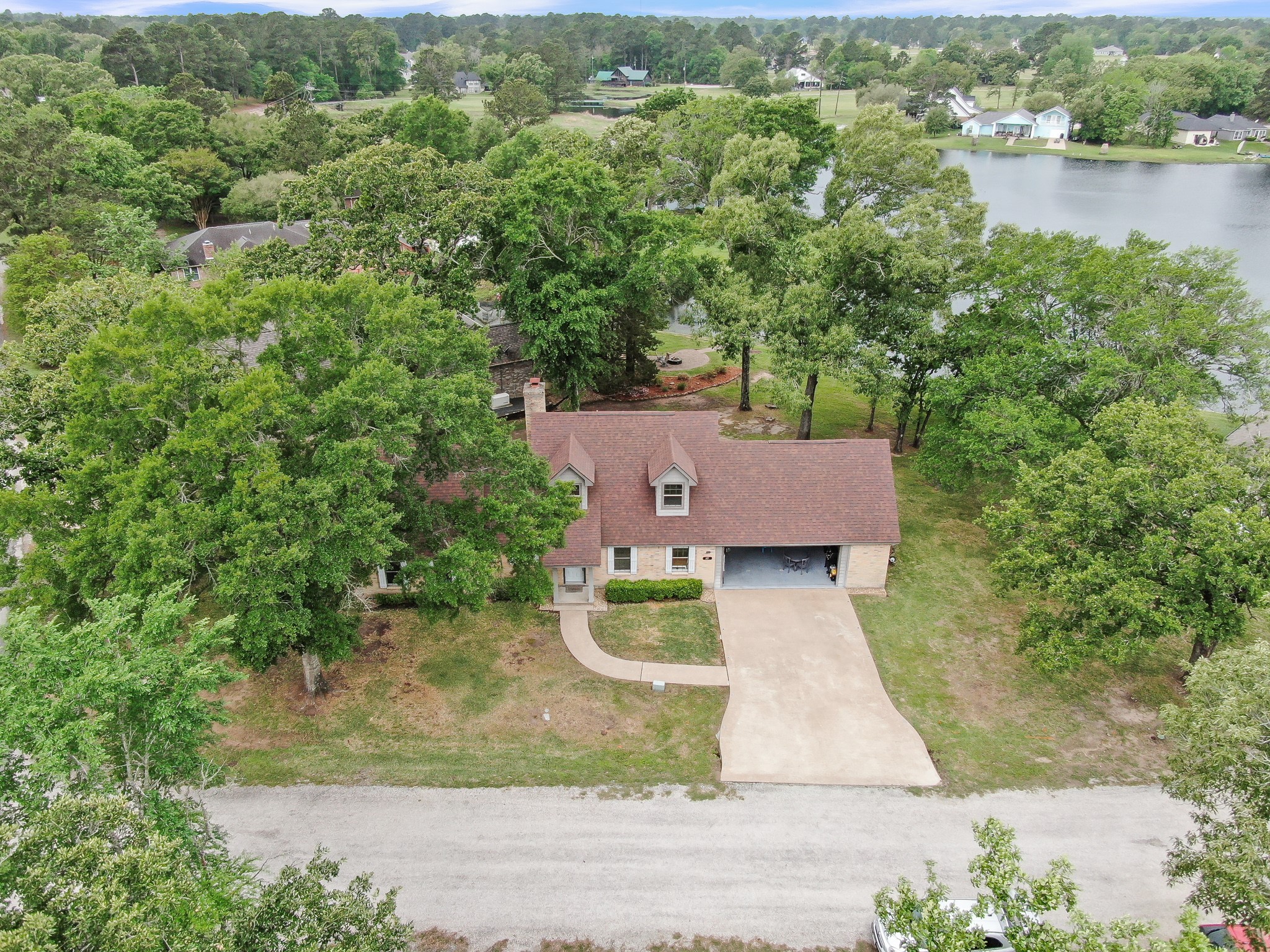 117 Brookside Drive Trinity, TX 75862 - Photo 9 of 46 an aerial view of a house with outdoor space and lake view