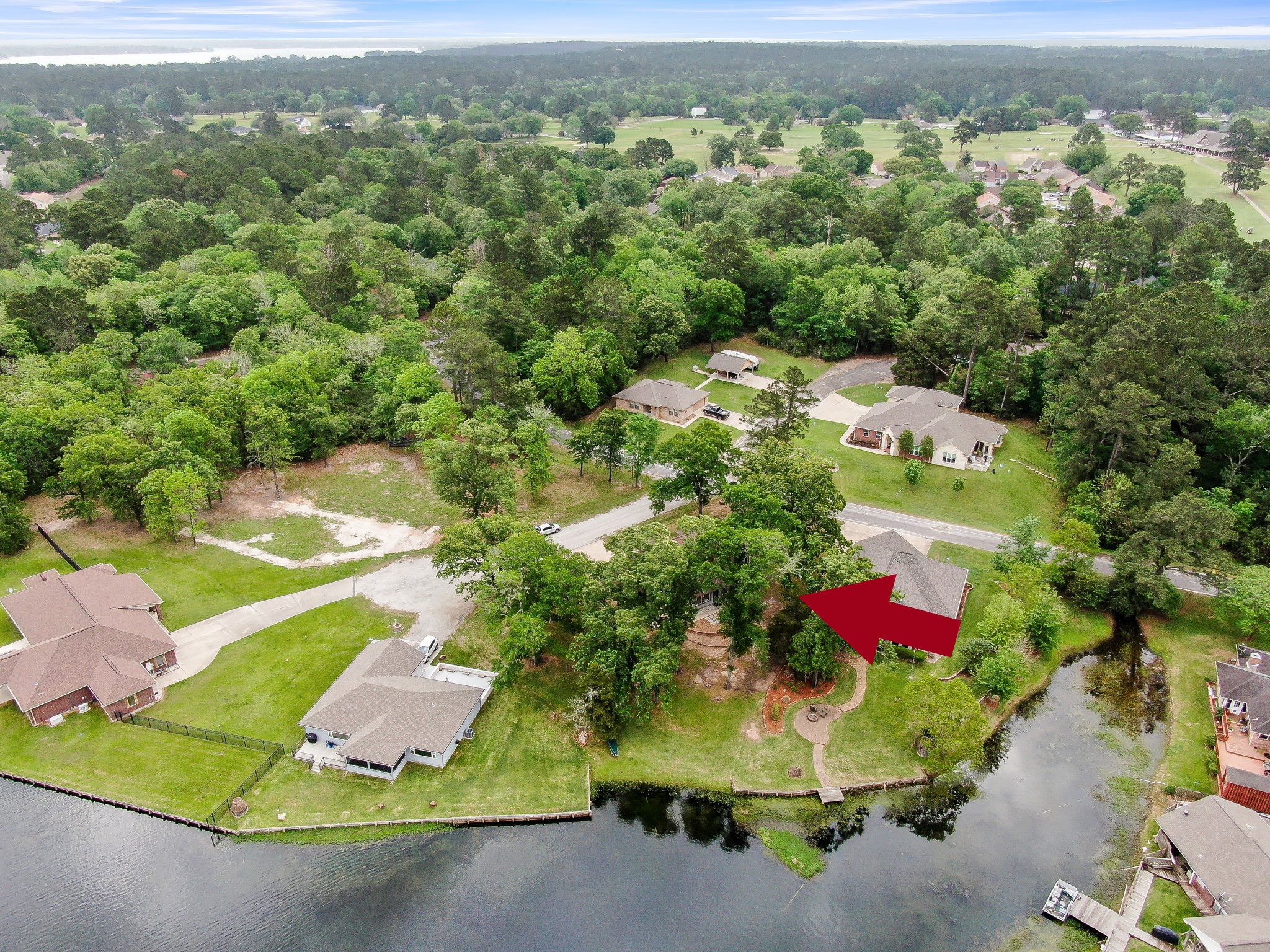 117 Brookside Drive Trinity, TX 75862 - Photo 10 of 46 an aerial view of a house with a yard and lake view