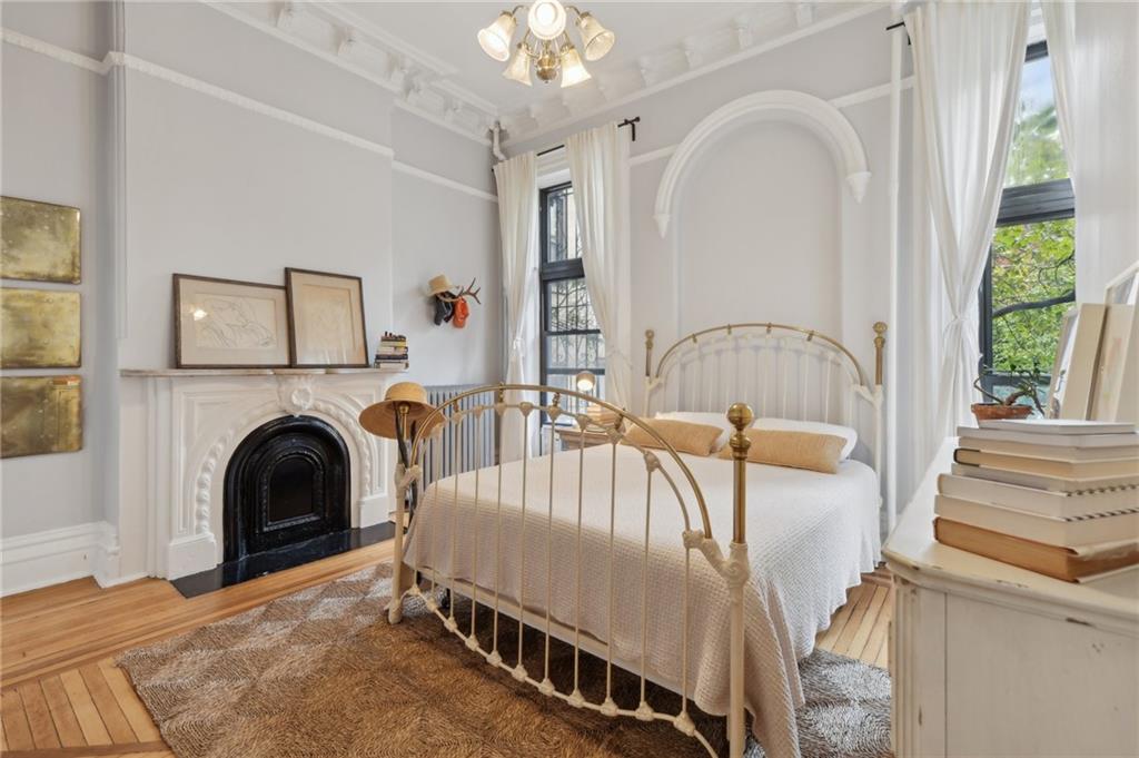 146 St James Place Brooklyn, NY 11238 - Photo 8 of 10 a living room with furniture and a fireplace