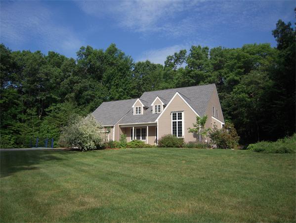 338 Robinson Road Boxborough, MA 01719 - Photo 1 of 18 a front view of a house with a yard