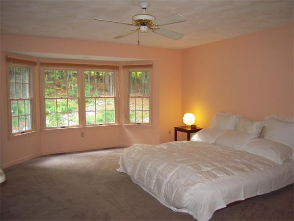 338 Robinson Road Boxborough, MA 01719 - Photo 8 of 18 a bedroom with a bed and a chandelier