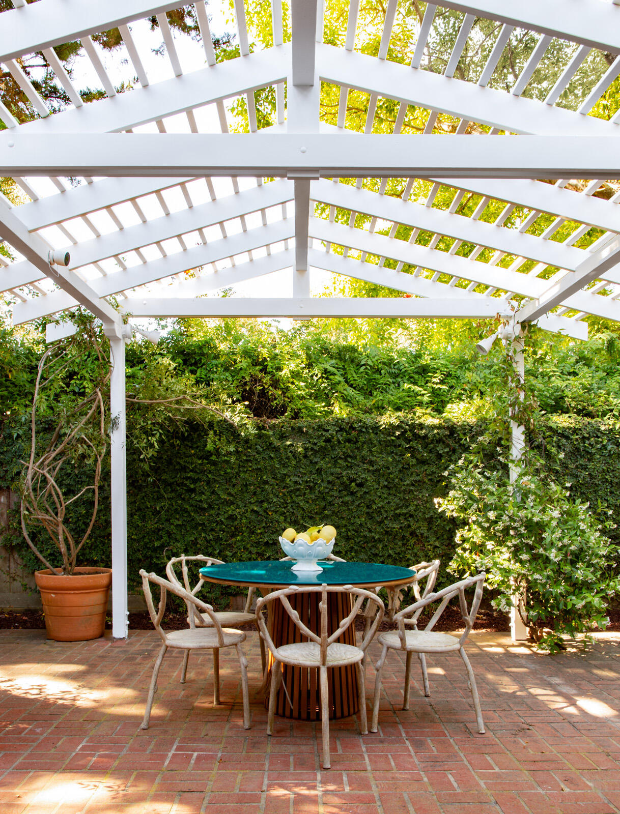279 Santa Rosa Lane Montecito, CA 93108 - Photo 11 of 27 a patio with table and chairs