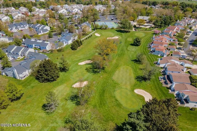 an aerial view of residential houses with swimming pool