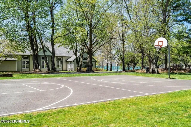 a view of a playground with basketball court