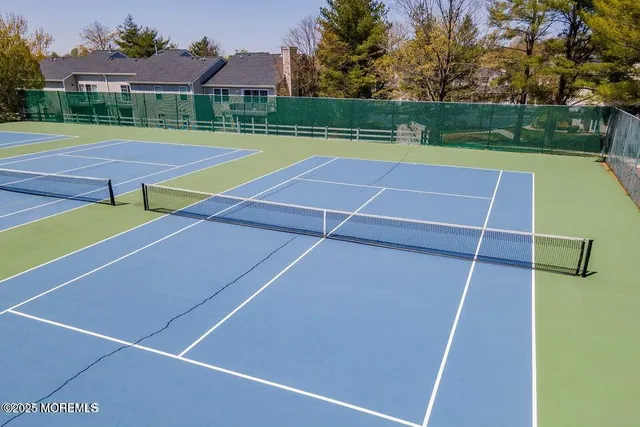 a view of an outdoor space and tennis court