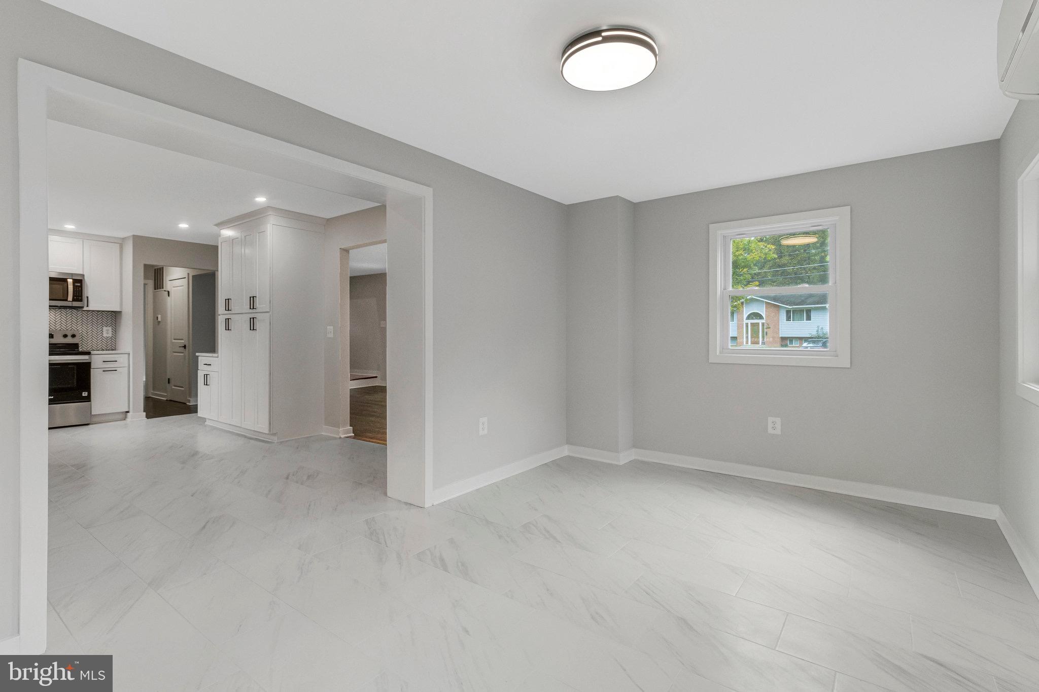5511 Callander Drive Springfield, VA 22151 - Photo 19 of 74 an empty room with a empty space and windows