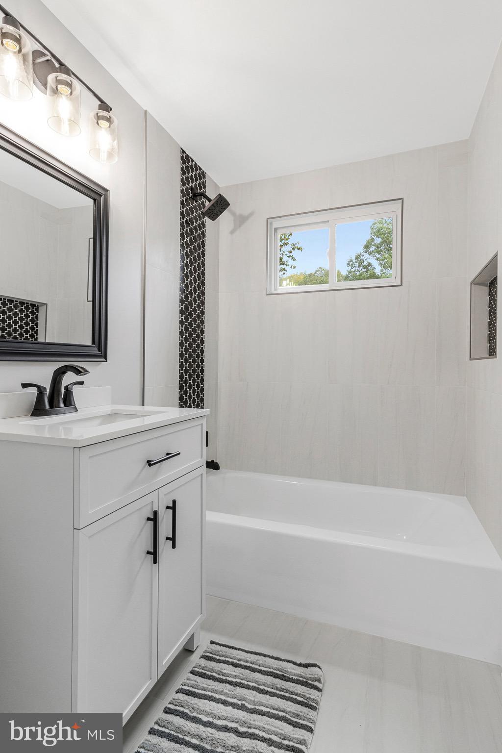 5511 Callander Drive Springfield, VA 22151 - Photo 38 of 74 a bathroom with a bathtub and a sink